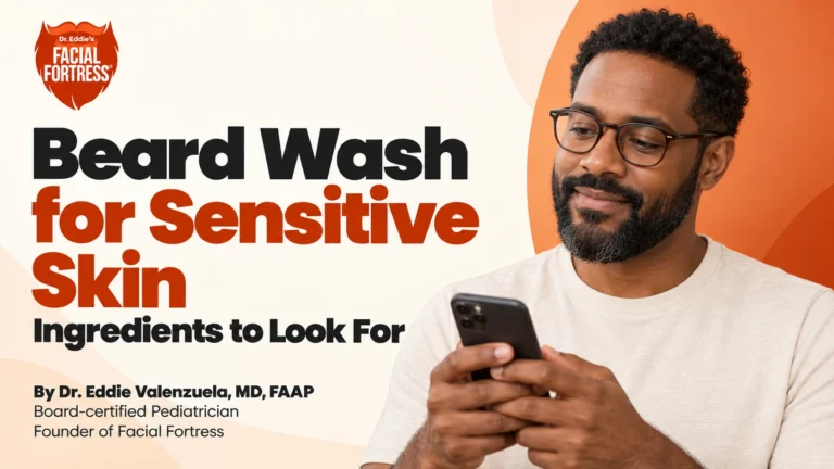 Beard wash for sensitive skin: a bearded man reads on his phone; ingredients to look for.